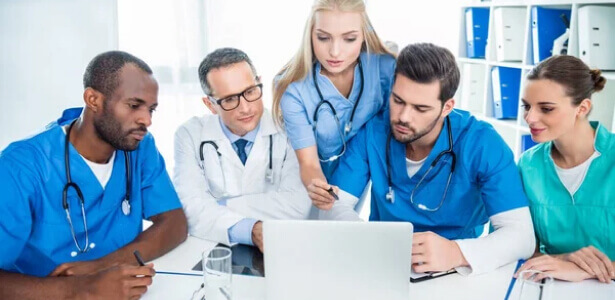 Medical staff discussing pre-operative details before surgery